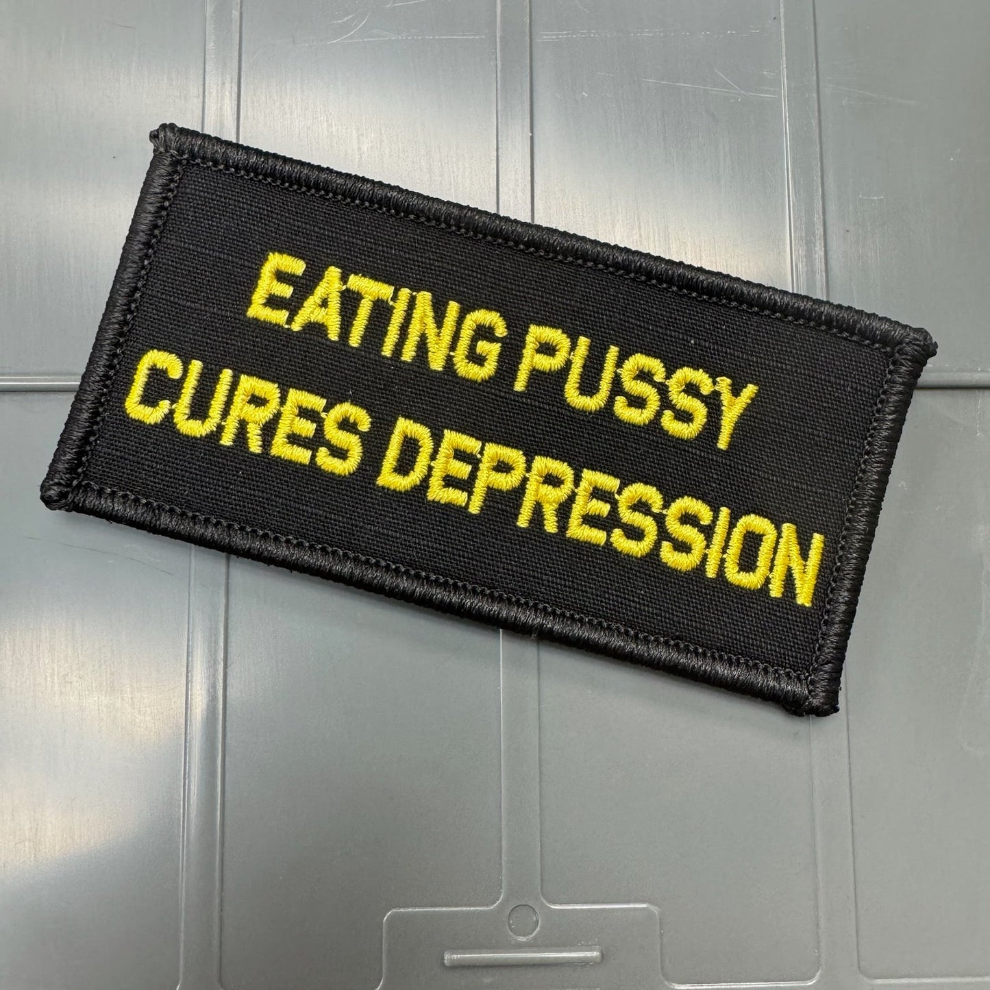 As Seen on Socials - Eating Pussy Cures Depression - 2x4 Patch - Black w/Gold